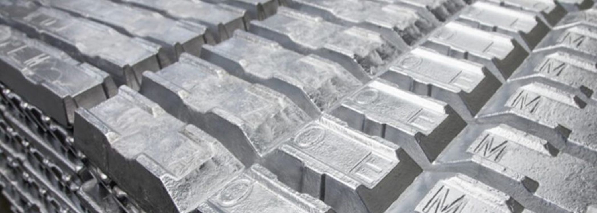 Aluminum alloy ingots stacked in rows